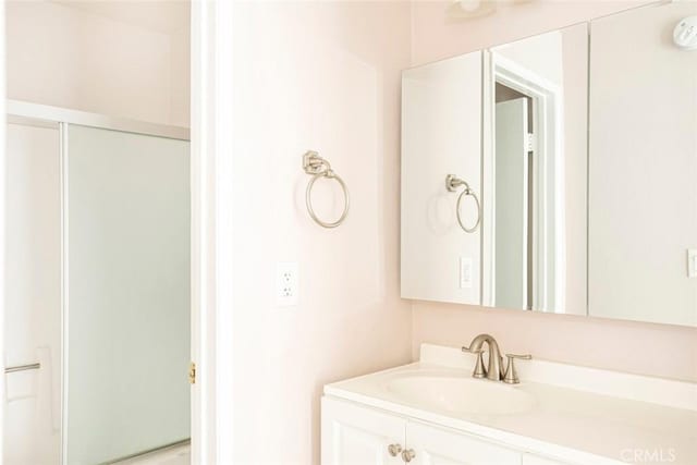 bathroom with vanity and walk in shower