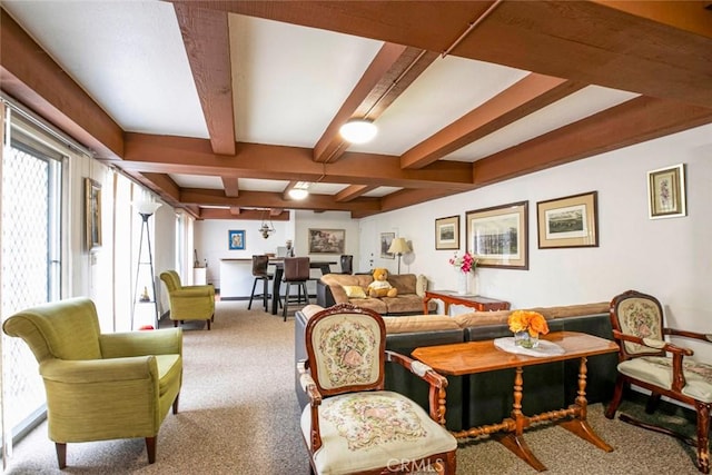 carpeted living room featuring beam ceiling