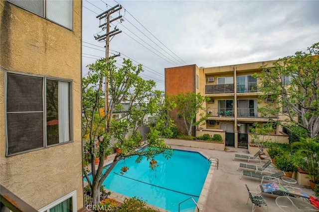 view of swimming pool featuring a patio