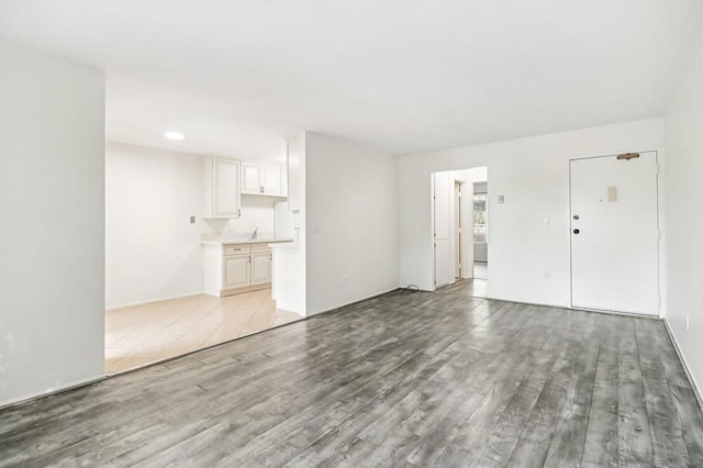 unfurnished living room featuring light hardwood / wood-style flooring