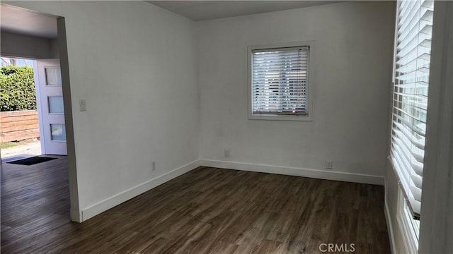 spare room featuring dark hardwood / wood-style flooring