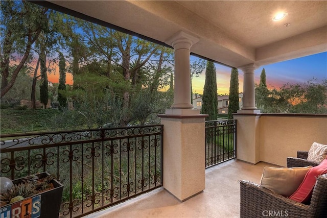 view of balcony at dusk