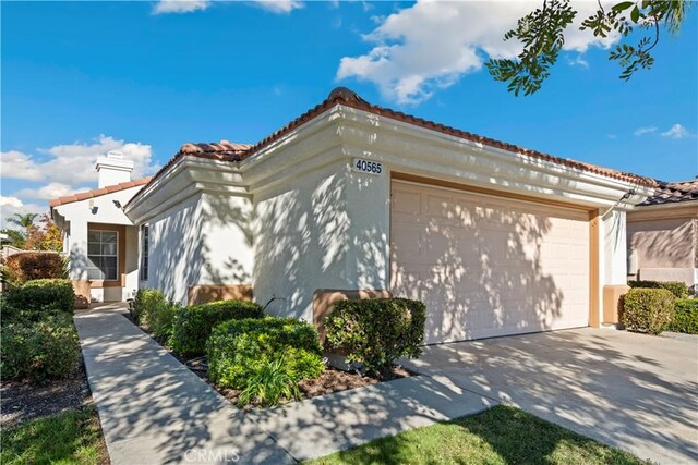 view of side of property featuring a garage