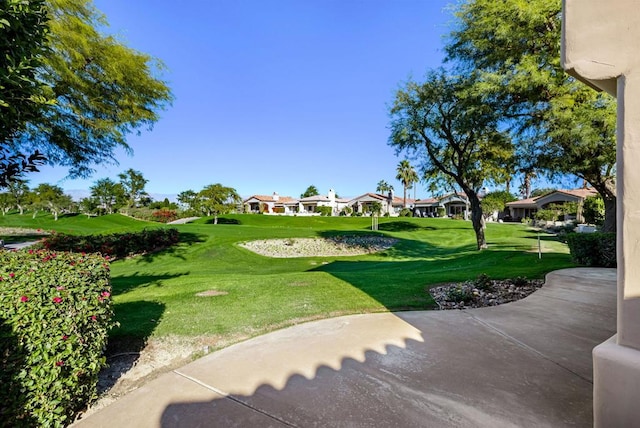 view of home's community with a lawn