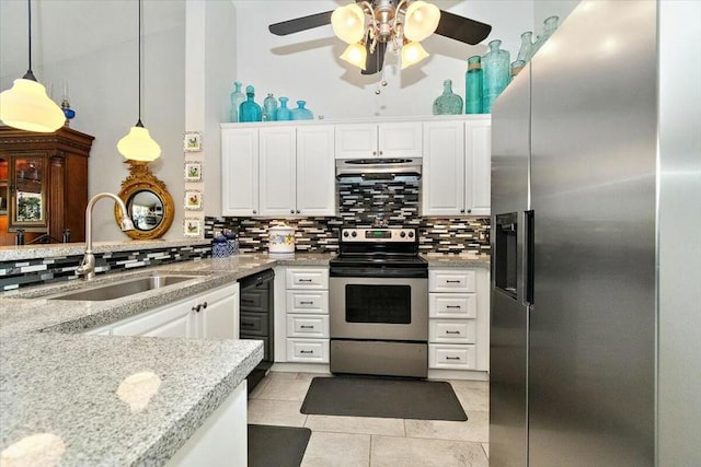 kitchen featuring sink, decorative light fixtures, decorative backsplash, white cabinets, and appliances with stainless steel finishes