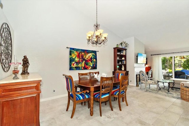 dining space with lofted ceiling and a notable chandelier