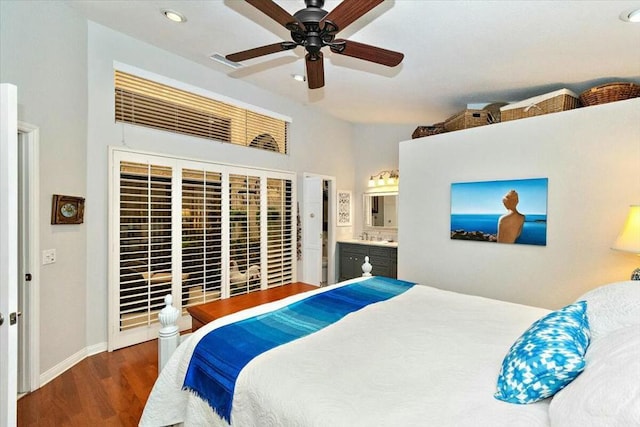 bedroom featuring connected bathroom, ceiling fan, and dark hardwood / wood-style floors