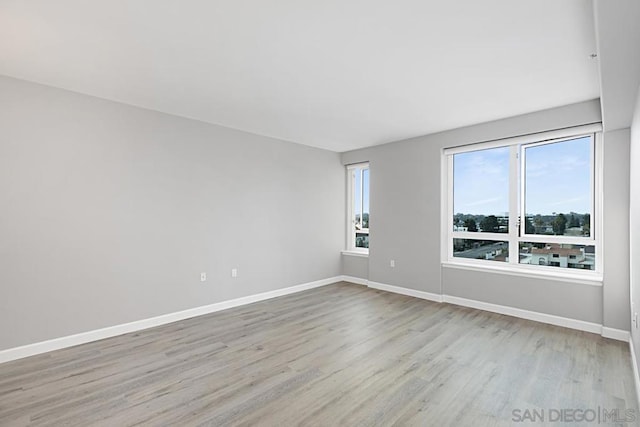 unfurnished room featuring light hardwood / wood-style floors