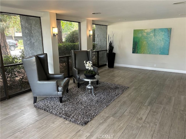 8635 Falmouth Ave Unit 301, Playa Del Rey, CA 90293 - sitting room featuring baseboards and wood finished floors