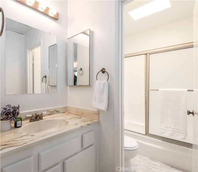 8635 Falmouth Ave Unit 301, Playa Del Rey, CA 90293 - bathroom with vanity, combined bath / shower with glass door, and toilet