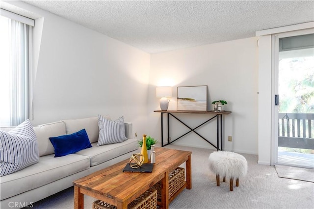8635 Falmouth Ave Unit 301, Playa Del Rey, CA 90293 - living room with carpet floors, a textured ceiling, and a wealth of natural light