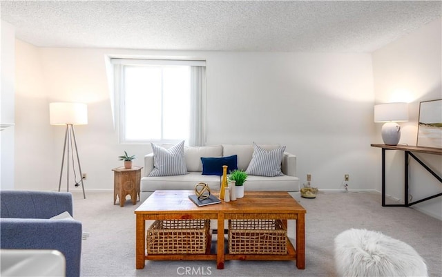 carpeted living room featuring a textured ceiling