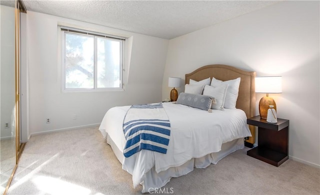 8635 Falmouth Ave Unit 301, Playa Del Rey, CA 90293 - carpeted bedroom with a textured ceiling and baseboards