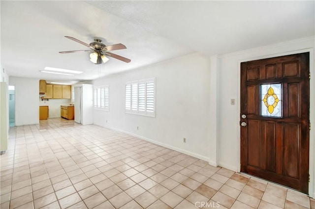 entrance foyer with ceiling fan and light tile patterned floors