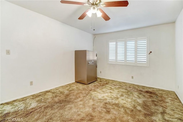 empty room with ceiling fan and carpet