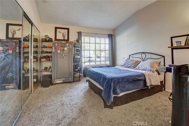 11350 Foothill Blvd Unit 30, Sylmar, CA 91342 - carpeted bedroom featuring a textured ceiling, vaulted ceiling, and a closet
