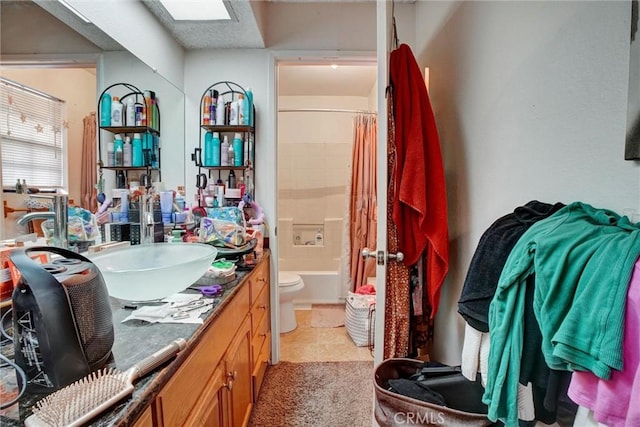 full bathroom with tile patterned flooring, vanity, toilet, and shower / bathtub combination with curtain