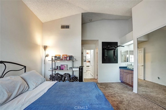 carpeted bedroom featuring ensuite bathroom, high vaulted ceiling, and a textured ceiling