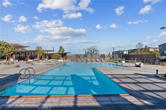 view of swimming pool featuring a patio