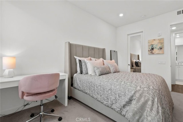 bedroom featuring light carpet