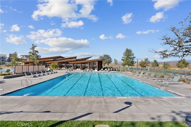 view of swimming pool with a patio