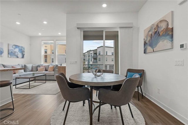 dining area featuring hardwood / wood-style floors