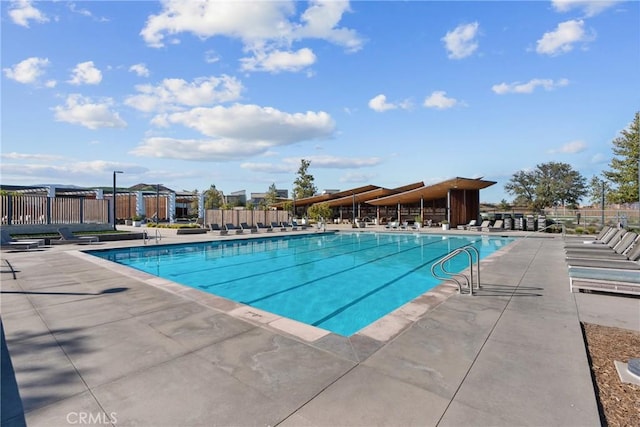 view of swimming pool featuring a patio