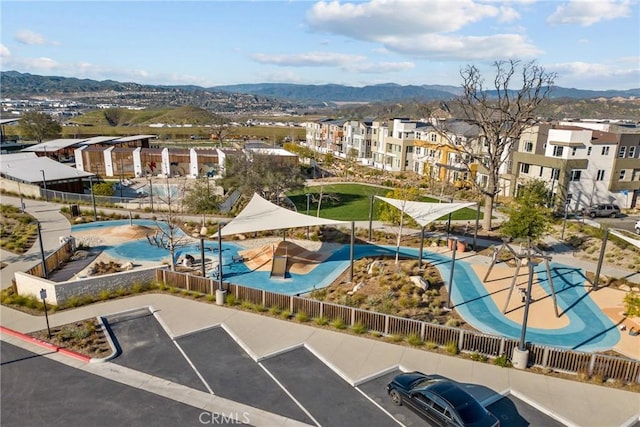 birds eye view of property with a mountain view