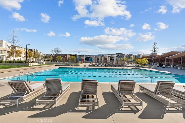 view of swimming pool with a patio