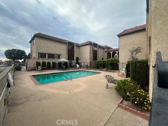 view of pool featuring a patio