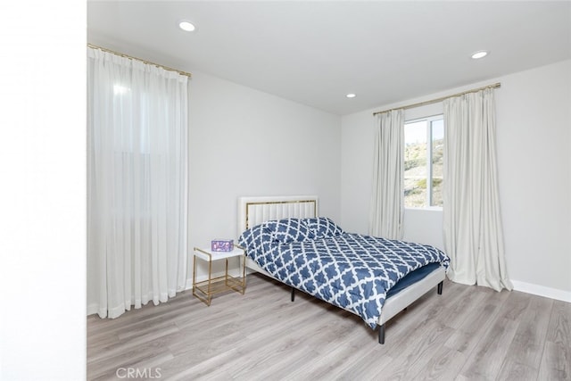 bedroom with light hardwood / wood-style floors