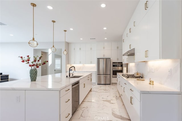 kitchen featuring white cabinets, stainless steel appliances, hanging light fixtures, and sink