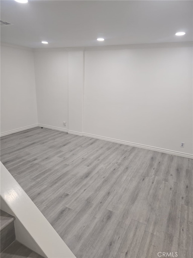 spare room with light hardwood / wood-style flooring