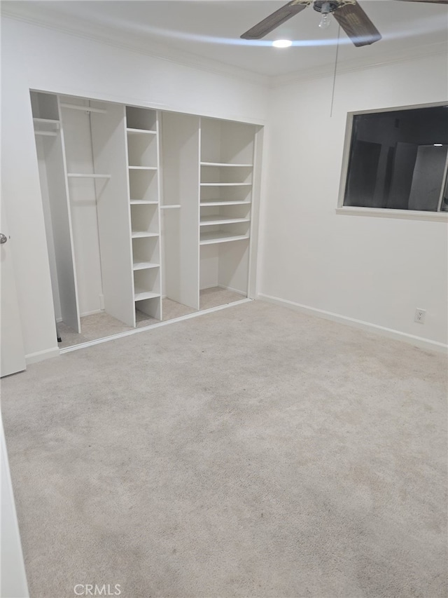 unfurnished bedroom with ceiling fan, light carpet, and ornamental molding