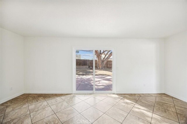 unfurnished room featuring light tile patterned floors