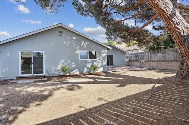 back of house featuring a patio area