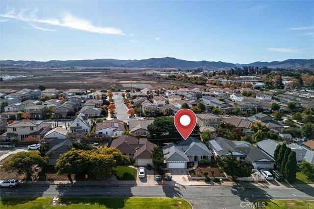 birds eye view of property featuring a mountain view