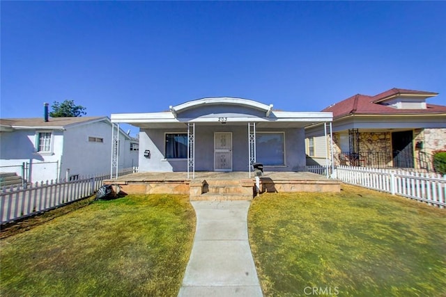 view of front of house featuring a front lawn and a porch