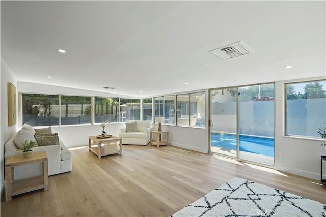 sunroom / solarium with lofted ceiling