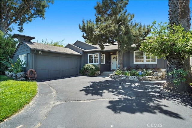 single story home featuring a garage