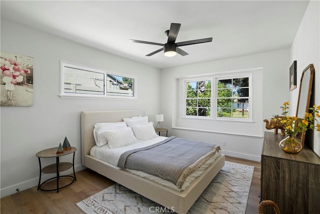 bedroom featuring ceiling fan and wood-type flooring