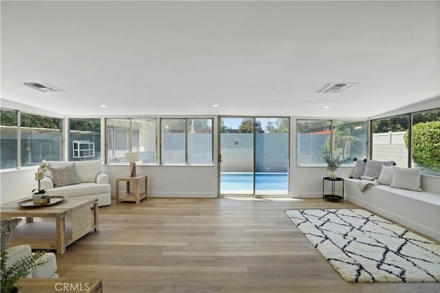 sunroom / solarium featuring a wealth of natural light