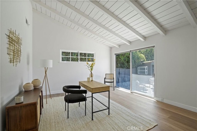 office area with lofted ceiling with beams and light wood-type flooring