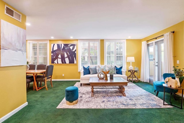 carpeted living room featuring a wealth of natural light