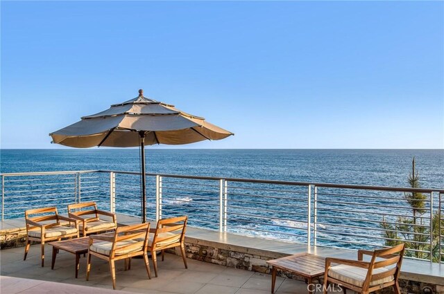 balcony featuring a water view