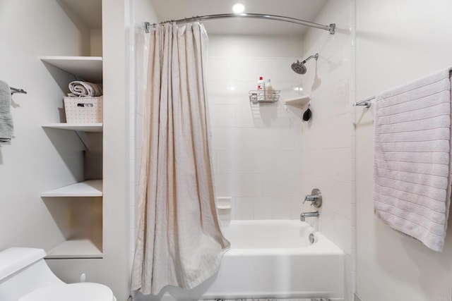 bathroom with shower / tub combo with curtain and toilet