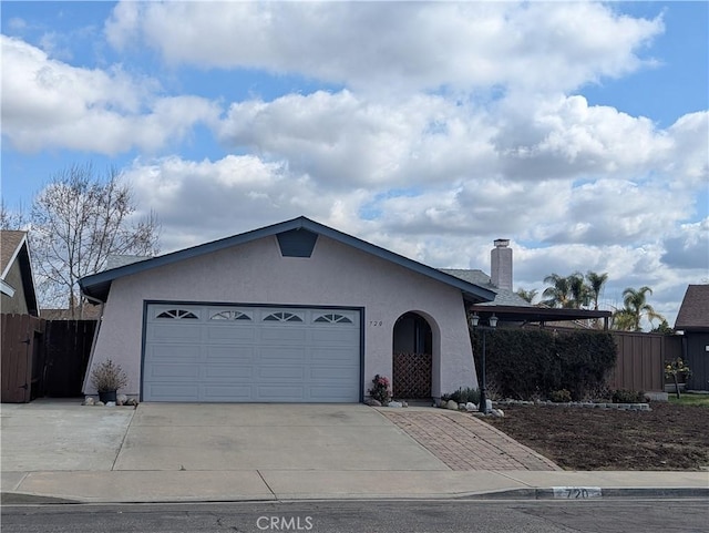 single story home featuring a garage