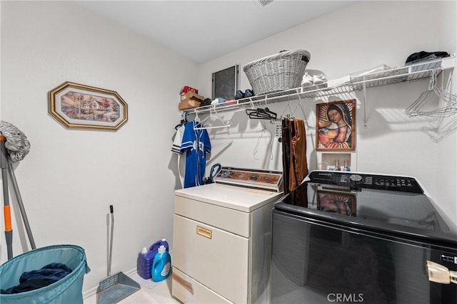 laundry room featuring separate washer and dryer