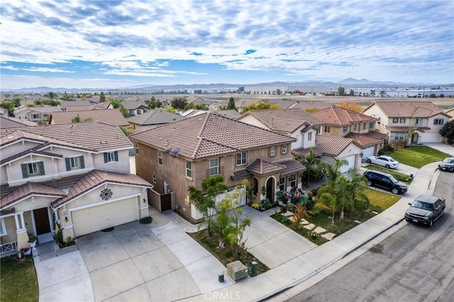 birds eye view of property featuring a mountain view