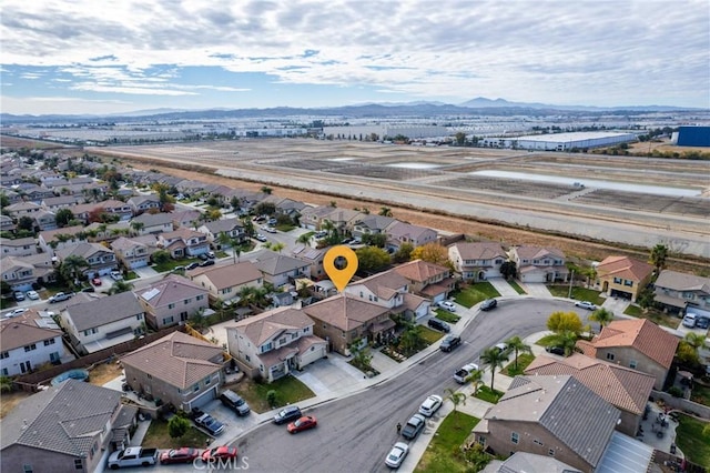 bird's eye view featuring a residential view and a mountain view